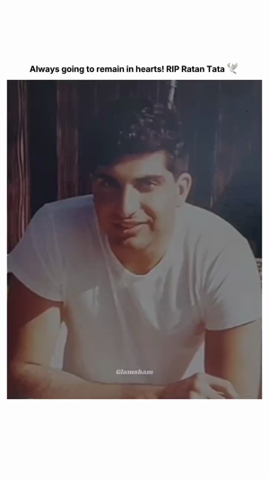 A young Ratan Tata smiling wearing a white t-shirt with a memorial caption above.