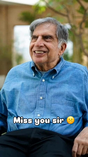 A portrait of Ratan Tata wearing a blue denim shirt with the text Miss you sir